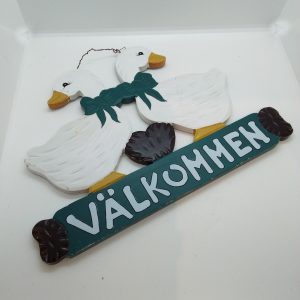 Skylt "Välkommen"